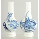 A FINE PAIR OF CHINESE BLUE AND WHITE PORCELAIN BOTTLE VASES, one painted with a warrior riding a