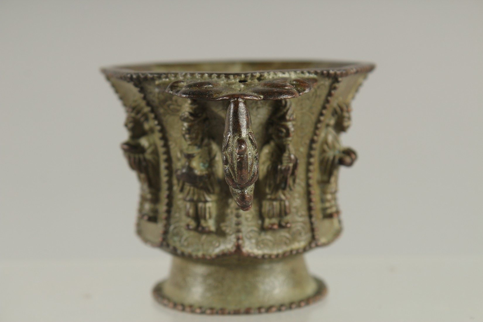 A CHINESE BRONZE CUP WITH RELIEF CAST FIGURES, mark to base possibly Da Tang Zhen Guan (true - Image 2 of 6