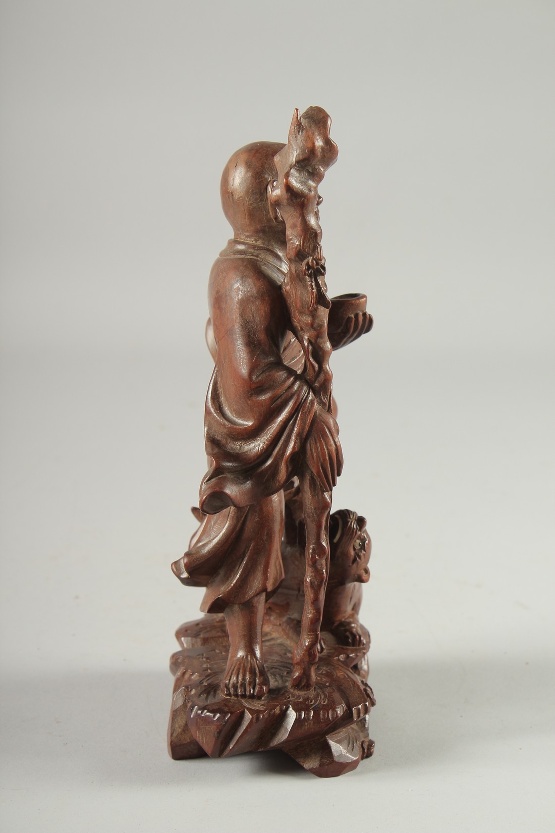 A CHINESE CARVED HARDWOOD FIGURE, 25.5cm high. - Image 2 of 6