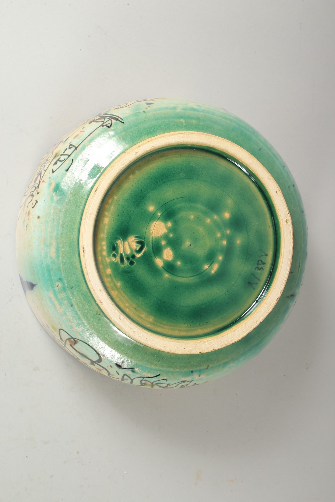 A VINTAGE KHOROSAN STYLE GLAZED POTTERY BOWL, painted with a figure and calligraphy, 21cm diameter. - Image 3 of 3