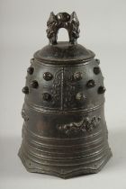 A CHINESE BRONZE PRAYER BELL, 19cm high.