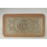 A VERY LARGE PERSIAN ISFAHAN EMBOSSED AND CHASED TINNED COPPER RECTANGULAR TRAY, with a central