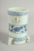 A CHINESE BLUE AND WHITE PORCELAIN BRUSH POT / VASE, with moulded chilong and tripod legs, 15cm