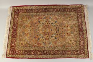 A SILK AND METAL THREADED HEREKE RUG, 101cm x 69cm.