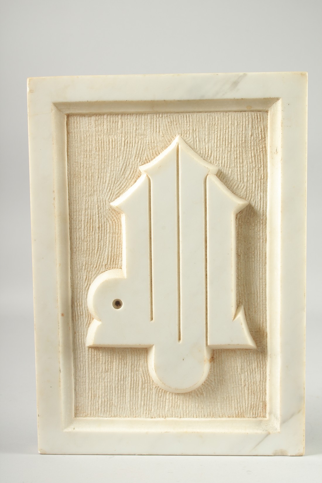 A CARVED WHITE MARBLE CALLIGRAPHIC PANEL, 35cm x 25cm.