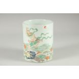A CHINESE FAMILLE VERTE PORCELAIN BRUSH POT, painted with an immortal stood upon a dragon on