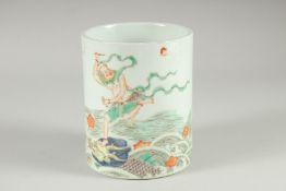 A CHINESE FAMILLE VERTE PORCELAIN BRUSH POT, painted with an immortal stood upon a dragon on