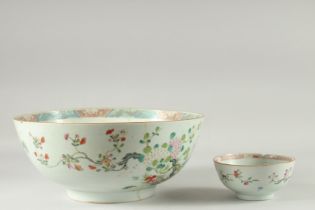 A LARGE CHINESE FAMILLE ROSE PORCELAIN PUNCH BOWL, together with a smaller famille rose bowl, (