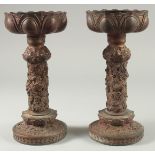 A PAIR OF CHINESE ARCHAIC STYLE GILT BRONZE CANDLESTICKS, 28cm high.