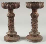 A PAIR OF CHINESE ARCHAIC STYLE GILT BRONZE CANDLESTICKS, 28cm high.