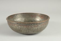 A 17TH CENTURY SAFAVID IRAN TINNED COPPER BOWL, with bands of engraved calligraphic inscription,