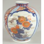 A FINE JAPANESE IMARI PORCELAIN BULBOUS VASE, beautifully painted with panels of birds and native