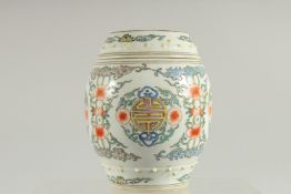 A CHINESE BARREL-FORM PORCELAIN JAR AND COVER, painted with longevity symbol, base with six-