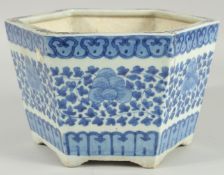 A 19TH CENTURY CHINESE BLUE AND WHITE HEXAGONAL JARDINIERE, painted with foliate decoration, (one