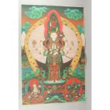 A TIBETAN THANGKA MOUNTED ON PAPER.