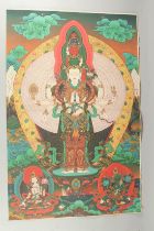 A TIBETAN THANGKA MOUNTED ON PAPER.