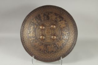 A VERY FINE 19TH CENTURY NORTH INDIAN GOLD INLAID ENGRAVED STEEL SHIELD, decorated with a band of