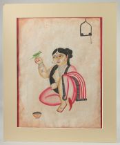 KALIGHAT SCHOOL BENGAL PAINTING ON PAPER OF A LADY WITH BIRD, with mount and mount board surround;