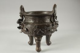 A LARGE CHINESE BRONZE TWIN HANDLE TRIPOD CENSER, with relief horses and sea creatures, the