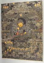 A TIBETAN THANGKA MOUNTED ON PAPER.