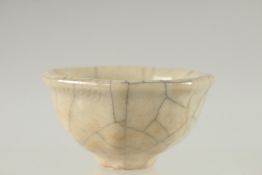 A SMALL CHINESE OCTAGONAL CRACKLE GLAZE BOWL, 9cm wide.