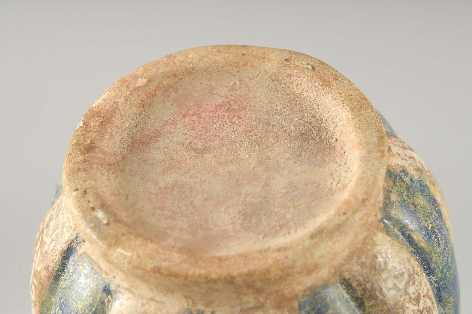 A KASHAN STYLE GLAZED POTTERY VASE, the body of ribbed form with panels of - Image 6 of 6