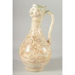 A KASHAN STYLE MOULDED HEAD EWER, the body painted with stylised animal motifs and