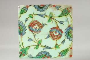 A 17TH CENTURY OTTOMAN TURKISH IZNIK GLAZED POTTERY TILE, 25cm square.