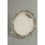 A GOOD SILVER PIE CRUST SALVER with scroll and floral border. 12ins diameter. Sheffield, 1904.