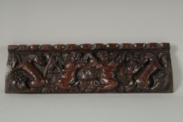 A VERY GOOD 17TH CENTURY CARVED OAK PANEL, musicians. 15ins x 4ins.