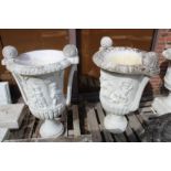 A LARGE PAIR OF ITALIAN CARVED WHITE MARBLE TWO HANDLED URNS with classical figures. 4ft high.