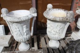 A LARGE PAIR OF ITALIAN CARVED WHITE MARBLE TWO HANDLED URNS with classical figures. 4ft high.