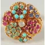 AN 18 CT GOLD TURQUOISE, RUBY, EMERALD, SAPPHIRE AND DIAMOND RING.