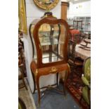 A GOOD FRENCH KINGWOOD ORMOLU MOUNTED VITRINE with mirrored backs, glass door and sides on curving