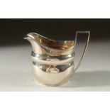 A GEORGE III MILK JUG London 1803.