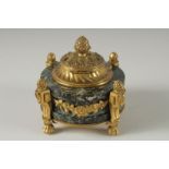 A GOOD 19TH CENTURY FRENCH CIRCULAR MARBLE AND ORMOLU INKWELL with pineapple finial, on claw feet.