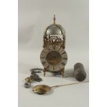 AN 18TH CENTURY BRASS LANTERN CLOCK with bell hood and fusee movement. 14ins high with chain, weight