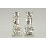 A PAIR OF ART DECO STYLE SILVER PLATED CAT SALT AND PEPPERS. 3ins high.