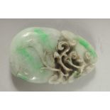 A LARGE CARVED JADE PENDANT. 3.5ins x 2ins.