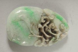 A LARGE CARVED JADE PENDANT. 3.5ins x 2ins.