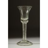 A GEORGIAN GLASS with inverted plain bowl and air twist stem. 6.5ins high.