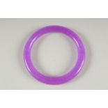 A LAVENDER JADE BANGLE. 3ins diameter.