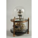 A DECORATIVE FISH CLOCK in a glass dome. 5.5ins high.