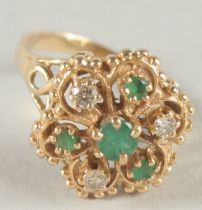 A 14CT GOLD DIAMOND AND EMERALD CLUSTER RING