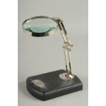 A MAGNIFYING GLASS on a stand.