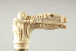 A WALKING STICK with carved bone handle. "HORSE & JOCKEY"