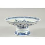 A Chinese blue and white pedestal dish. 8.5ins diameter.