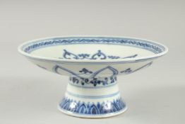 A Chinese blue and white pedestal dish. 8.5ins diameter.