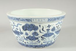 A CHINESE BLUE AND WHITE PORCELAIN BOWL decorated with fish and algae. 26cm diameter.