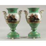 A PAIR OF SEVRES DESIGN TWO HANDLED URNS decorated with hunting scenes. 16ins high.